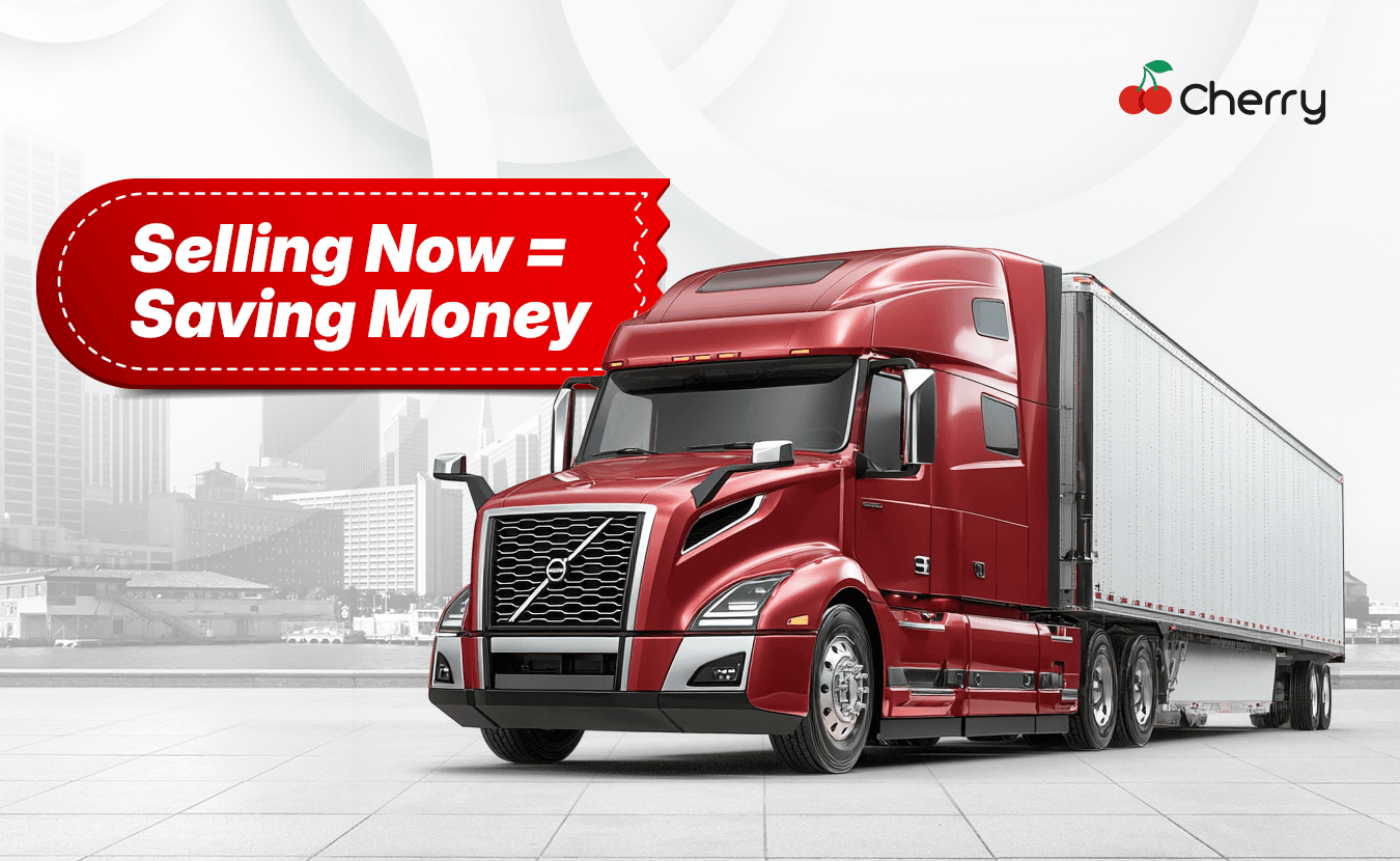 A semi-truck with a price tag graphic/text “Selling Now = Saving Money.”